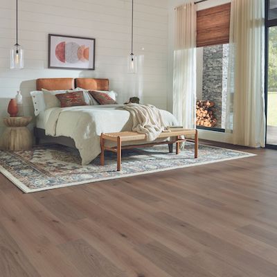 laminate flooring installation in a rustic bedroom